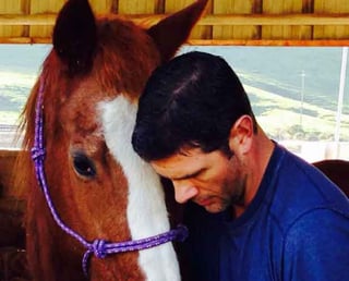 Jason with his horse.