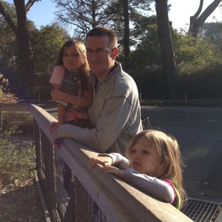 Joel at the zoo with his kids.