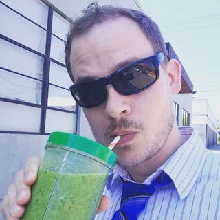Samuel drinking a healthy smoothie outside of the Endsight office building.