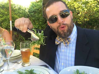 Adam eating salad.