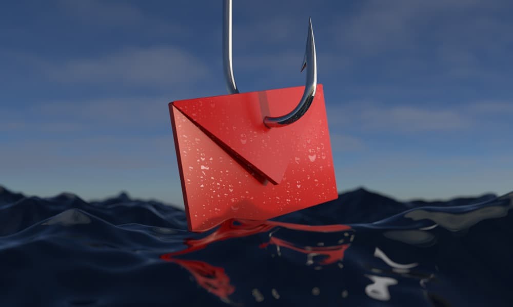 The image displays a red envelope on a large steel hook skirting the top of a body of water. 