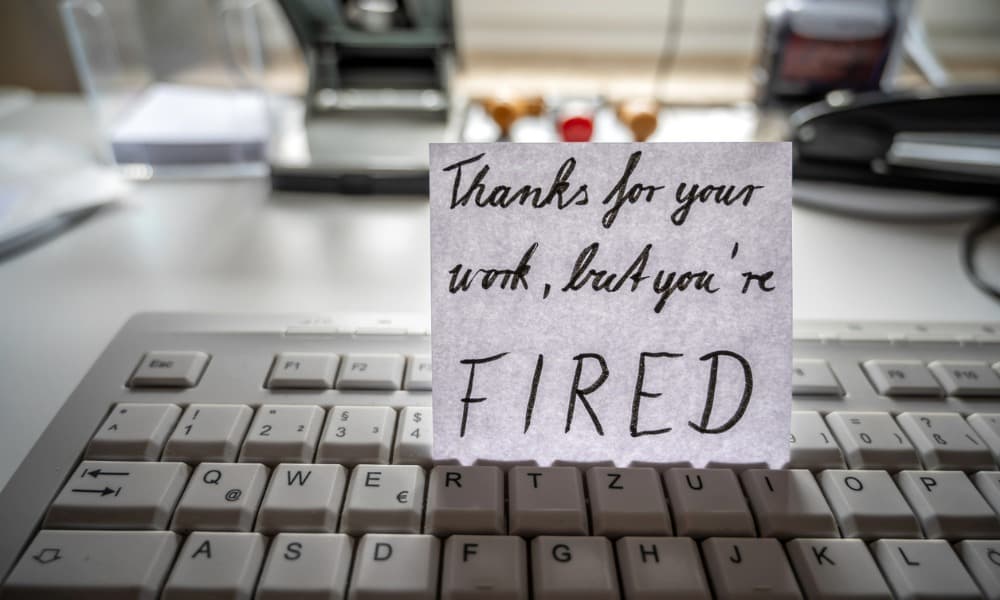 Message on the top of a desktop keyboard with notice depicting frustration with IT provider.